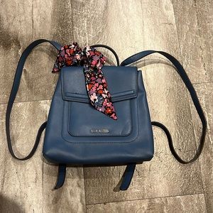 Small Steve Madden backpack with pink flower ribbon